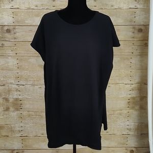 Woman Within Black Top With Side Slits